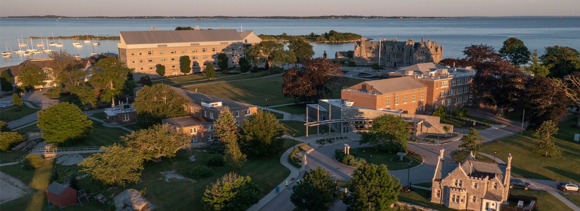 Aerial view of UConn Avery Point at sunset with Long Island Sound in the background.